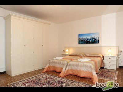 Second bedroom with two single beds and a sofa bed