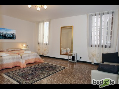 Second bedroom with two single beds and a sofa bed